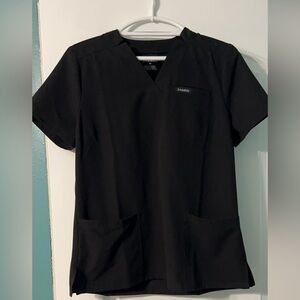 Jaanuu Black scrub top.